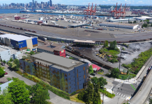 Housing Notes: 16-Story Tower Proposed in Kirkland and 114 Middle-Income Homes in West Seattle A photo of West Seattle near the bridge and Harbor Island with a rendering of an apartment building superimposed on top.