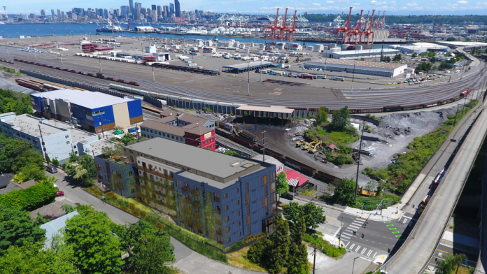 A photo of West Seattle near the bridge and Harbor Island with a rendering of an apartment building superimposed on top.