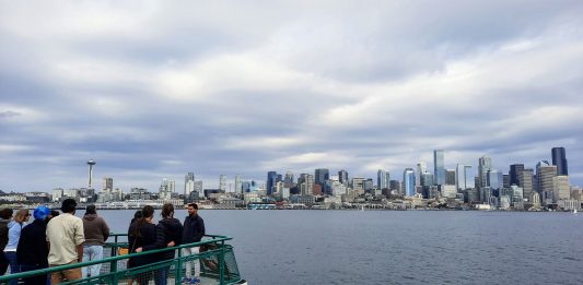 It's photo snapping time as the Bainbridge ferry approaches Seattle, offering sweeps shots of the skyline along the shores of Elliott Bay