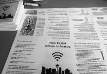 Proposed Digital Equity Bill Needs Support to Increase Broadband Access A black and white photo of a flyer instructing how to get online in Seattle.