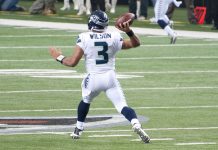 When Heroes Leave: What Russell Wilson Meant To Seattle A photo of a football player running with the ball.
