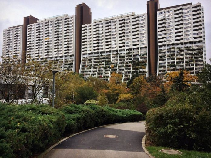 A photo of tower style housing with lots of plants