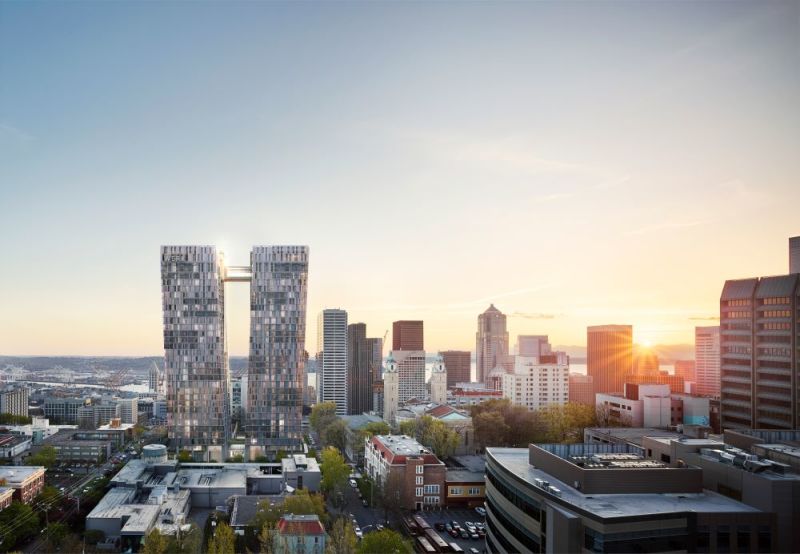 A photo of first hill with a rendering of two tall glass towers imposed on it.