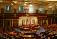 U.S. Voting Systems Should — And Can — Better Reflect Diversity in Representation A photo of a room with amphitheater style seating.