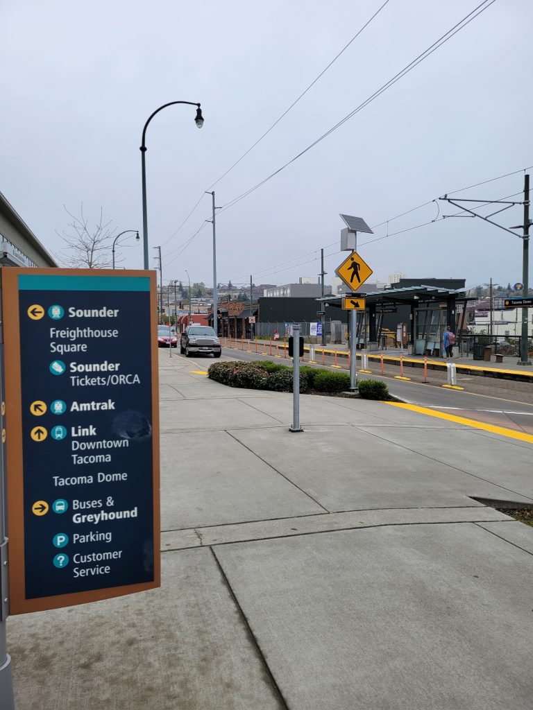 Signage at the Tacoma Dome streetcar station directing users to Amtrak, Sounder, and buses