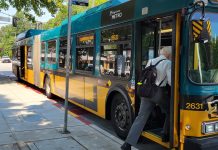 Your Transit Trips Are Free This Weekend, Let’s Celebrate! A man board an articulated bus.