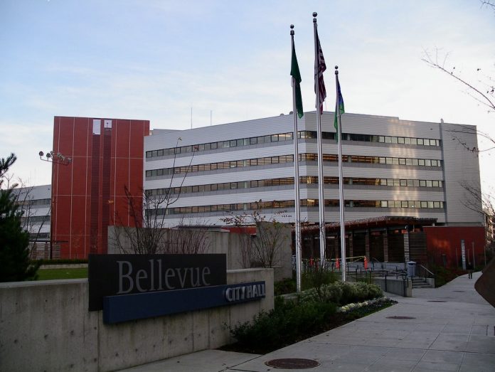 A photo of Bellevue city hall with flags