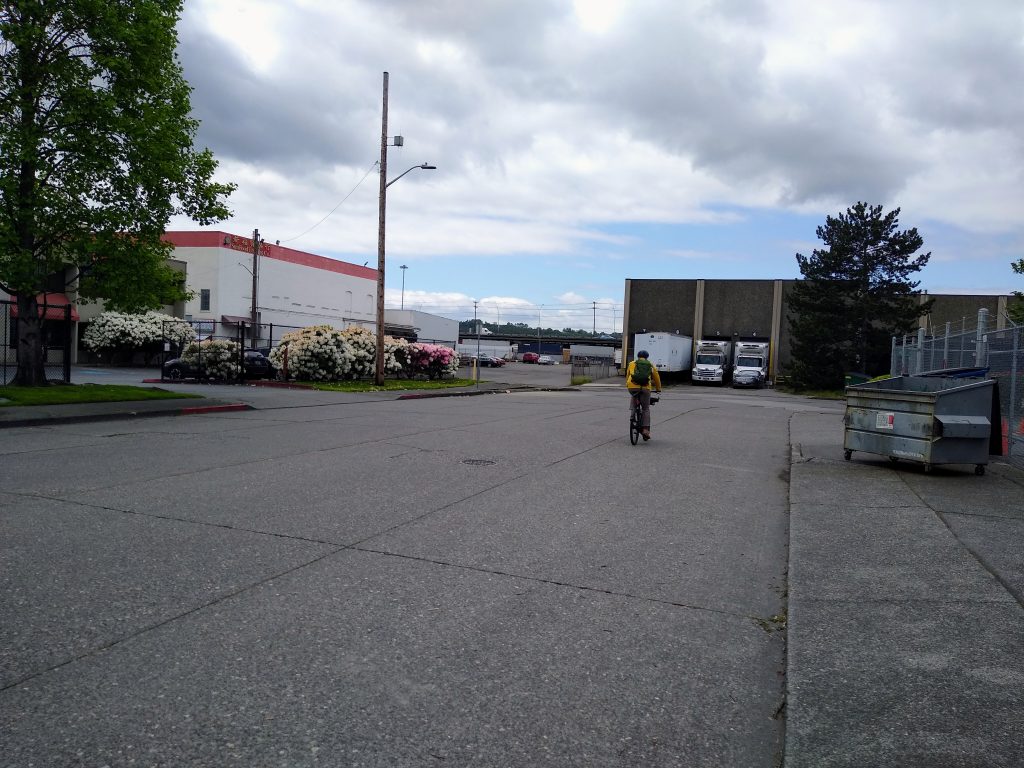 Someone on a bike using Alaska Street to cut between 6th Ave S and Airport Way