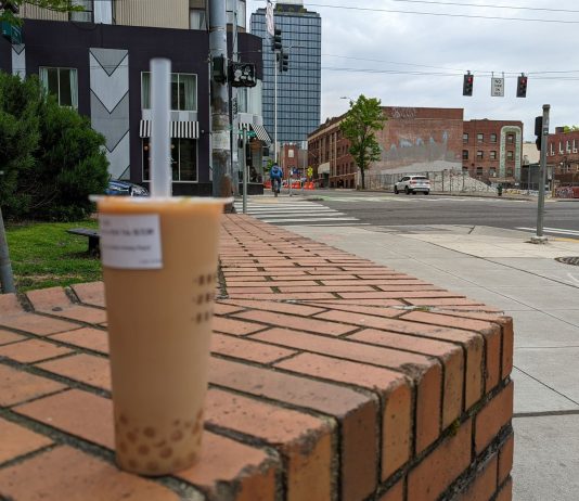 Boba: A Sweet Treat and Harbinger of Gentrification Milk tea and towers and construction in the background