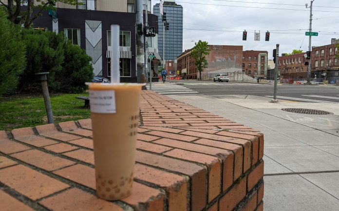 Milk tea and towers and construction in the background