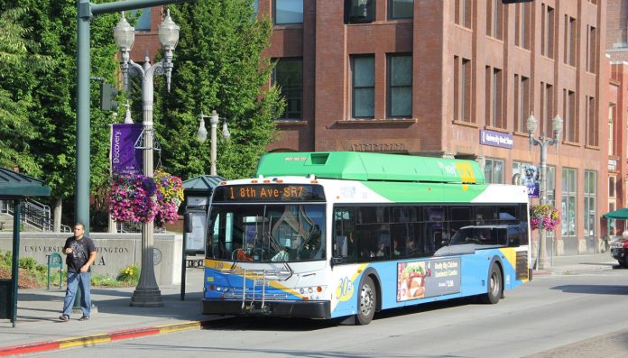 A Route 1 bus stops next to the University of Washington Tacoma campus.