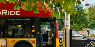 A man boards a rapid ride bus in Seattle