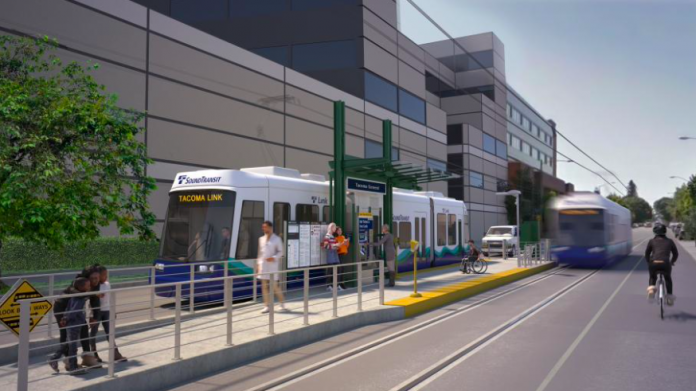 A rendering of an at grade light rail station with people waiting