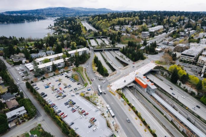 Mercer Island Station Mercer Island's light rail station, in the median of I-90, being constructed. Parking lots and low density development is visible on the periphery