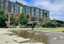 Breathing Life into Bellevue’s Spring District A photo of a fountain with an apartment building behind it.