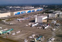 Op-Ed: Washington Legislature Must Break Boeing’s Corporate Handout Addiction An aerial photo of Boeing's sprawling Everett manufacturing plan with planes sitting on the tarmac.