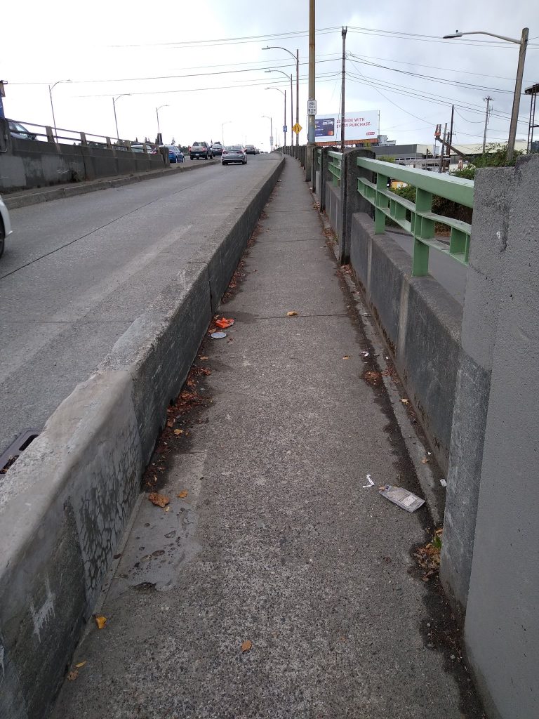 Narrow sidewalk on the Ballard Bridge that is technically a bike route