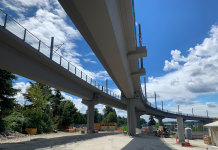 Broadening Our Scope: Publication Update Fall 2022 Curving, parallel concrete overpasses against a blue sky.