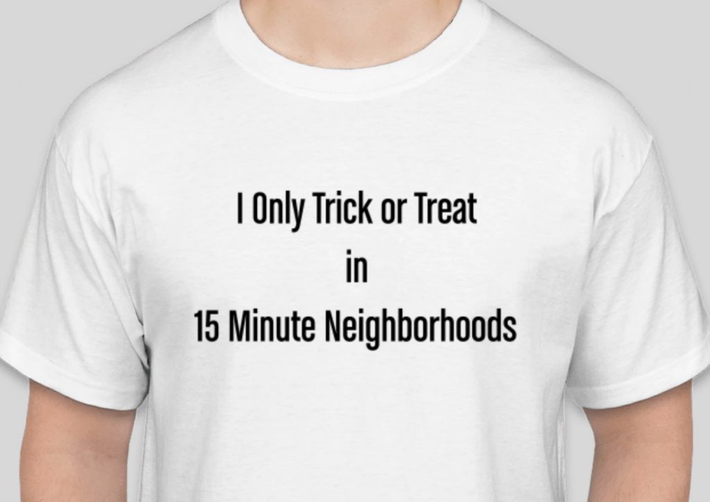 A white t-shirt reads "I only trick or treat in 15-minute neighborhoods"