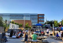 Rising Star Candidates Beyond Seattle People using outdoor seating during a Bothell festival.