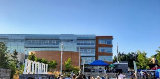 People using outdoor seating during a Bothell festival.