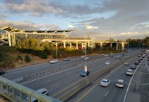 Sound Transit Recommends Costly, Car-Oriented Infill Station in Northern Tukwila The elevated station gleams as the sun is going down over a busy freeway trench.