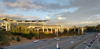 Sound Transit Recommends Costly, Car-Oriented Infill Station in Northern Tukwila The elevated station gleams as the sun is going down over a busy freeway trench.