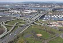 Washington State Is Losing Control of the Columbia Interstate Bridge Replacement Megaproject An aerial view of a enormous highway crossing the Columbia River, a rendering from 2013