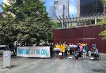 Op-Ed: Seattle Council Should Double Rental Assistance, Not Slash It A Stay Housed rally with a "Housing is the Cure" banner at Seattle City Hall with a crowd of about 50.