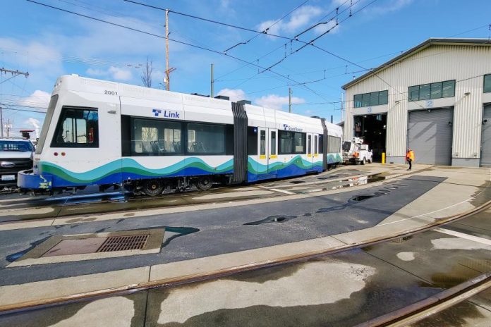 A streetcar vehicle rolls into a maintenance barn in Tacoma's facility.