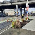 Railroad crossing sign with cyclist