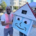 Andrew-Ashiofu-with-I-135-social-housing-mascot-via-campaign