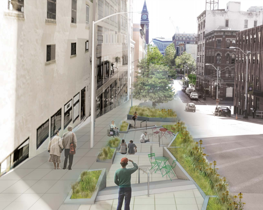 A zig zag seating area carved out next to the sidewalk south of 3rd and Yesler