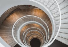 One Stairway is Enough to Reach Housing Heaven Looking down a circular staircase