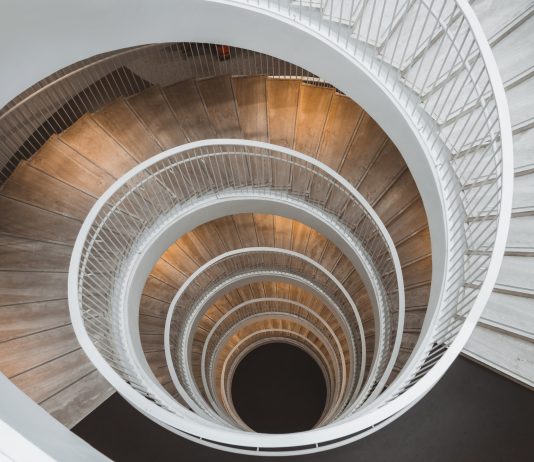 One Stairway is Enough to Reach Housing Heaven Looking down a circular staircase