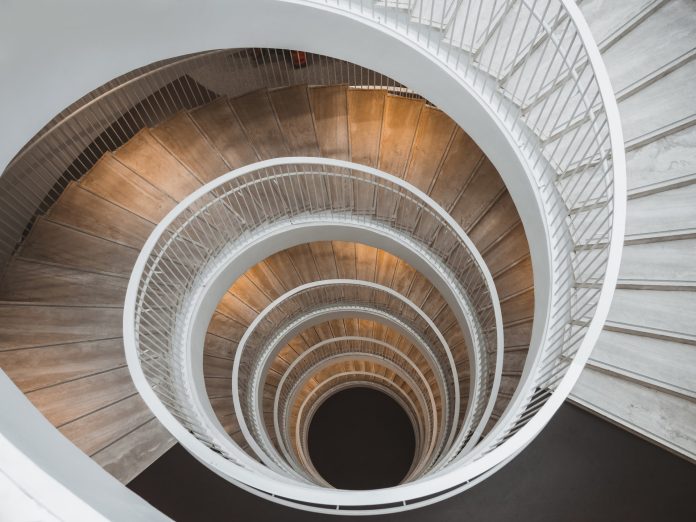natalya-letunova-nJ07EiRkMUY-unsplash (1) Looking down a circular staircase