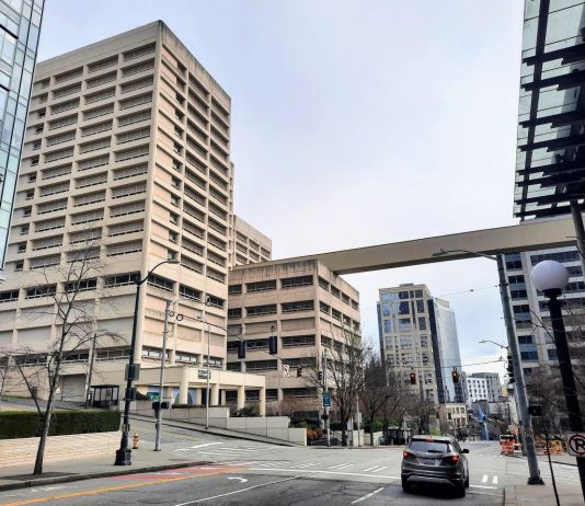 Sound Transit Board Backs Last-Minute Proposal to Skip Chinatown and Midtown Stations The view down 5th Avenue S with the King County Jail and skyway passage.