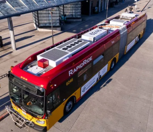 Metro Launches the H Line, its First RapidRide Line in Nine Years A red and yellow RapidRide bus waits at a stop at an off-street transit center