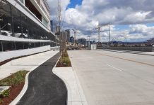Seattle Prepares to Open Brand New Elliott Way Highway Connector A four lane road with a raise bike lane and sidewalk