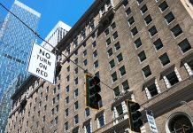 No Right Turn on Red Is Now the Default in Seattle A no turn on red sign in downtown Seattle with Rainier Tower building in the background