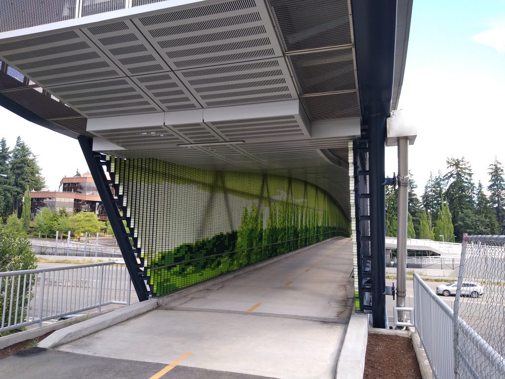 Multi-use trail bridge at the Overlake Station showing new art, a tile installation of 156,000 tiles, by Seattle artist, Leo Berk. 