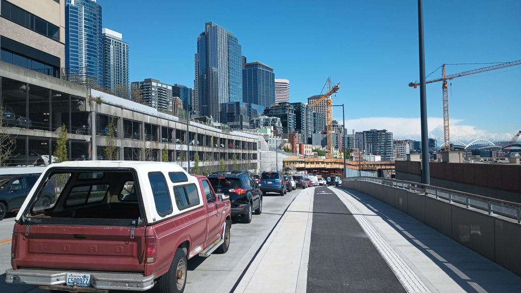 Four lane road next to Pike Place Market garage heading toward the waterfront from Belltown
