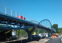Coming Pedestrian Bridges Will Create Invaluable Connections on the Eastside Construction equipment is visible on the pedestrian bridge over SR 520 in Totem Lake.