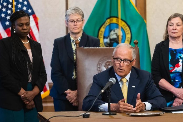 Inslee at signing by governor office