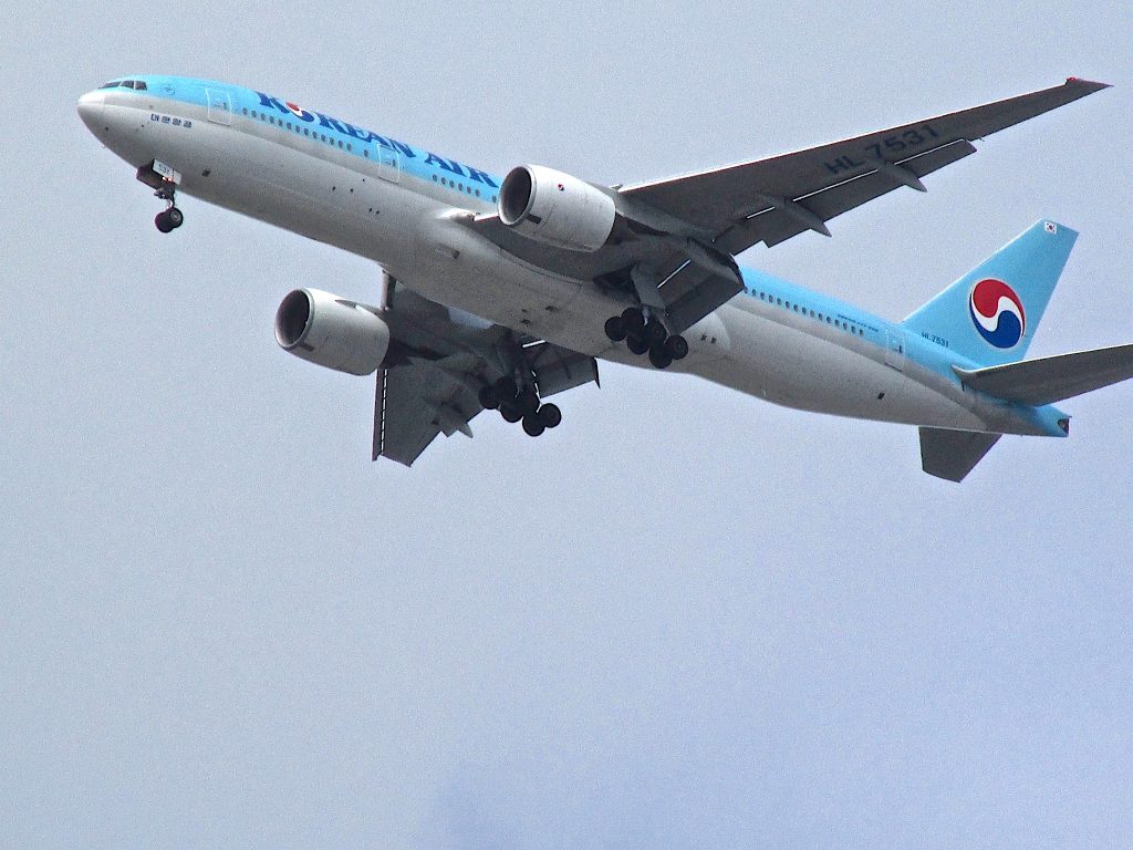 A commercial airliner taking off from a nearby international airport.