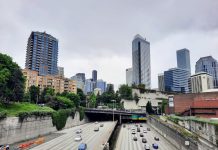 Americans Are Ready to Move On from Highway Expansion Even If Politicians Persist Seattle Skyline with I-5 trench and Freeway Park overhead.