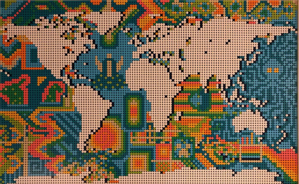 Close up of finished Lego world map with varied colorful patterns through the oceans that look like squids, monsters, and the weird horned thing from Zelda.