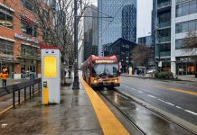 Harrell Advances New Denny Station Options That Could Delay Ballard Link A RapidRIde C bus pulls up to the transit stop in front of Whole Foods at Denny Way intersection on a wet afternoon.