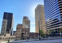 Seattle Hopes to Spur Office-to-Housing Conversions with Regulatory Incentives Third Avenue near Madison Avenue with office towers, some of the historic, in the background.