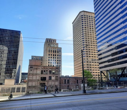 Seattle Hopes to Spur Office-to-Housing Conversions with Regulatory Incentives Third Avenue near Madison Avenue with office towers, some of the historic, in the background.